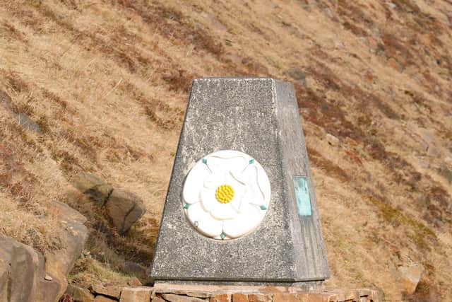 The Yorkshire Rose marker on the Lancashire Yorkshire border on the M62 motorway at Scammonden