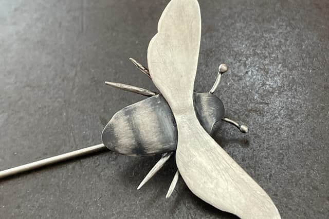 A Bee brooch pin in sterling silver, designed, created and photographed by Josephine Gomersall.