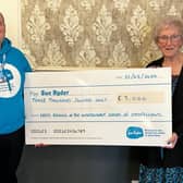 Michael Tarbutt, Sue Ryder Charity, receives £3000 cheque from Leeds Oddfellows Chairman, Enid Brook