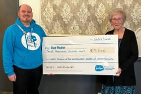 Michael Tarbutt, Sue Ryder Charity, receives £3000 cheque from Leeds Oddfellows Chairman, Enid Brook