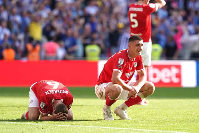 DESPAIR: Barnsley's Mads Andersen (left), Bobby Thomas and Liam Kitching look dejected after Sheffield Wednesday's Josh Windass scores the winning goal at Wembley Stadium Picture: Nick Potts/PA