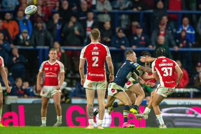 OVER YOU GO: Brad Schneider kicks the golden point winner for Hull KR to edge out hosts Leeds Rhinos at Headingley last night. Picture by Bruce Rollinson