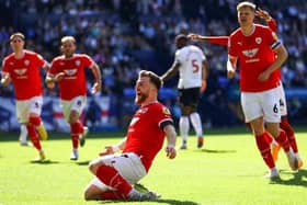 Barnsley defender Nicky Cadden pictured scoring in the League One play-off semi-finals at Bolton Wanderers last season. The Scot is hoping that the Reds achieve promotion via the conventional route in 2023-24. Picture: Michael Steele/Getty Images.