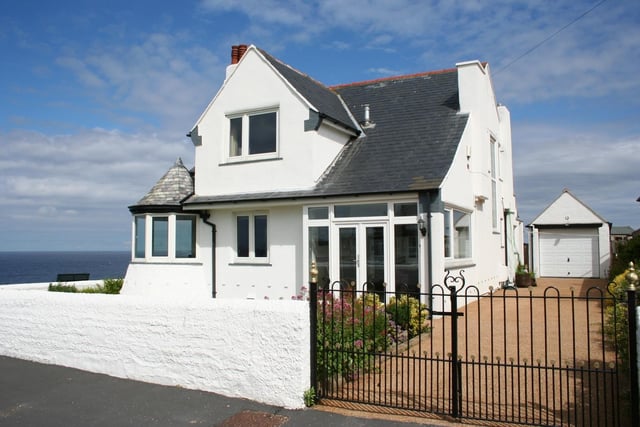 This property was the original Poet's View built in the 1920s but it was tired and in need of renovation when Martn and Jo bought it. They decided to replace it with a new version that makes the most of the sea views