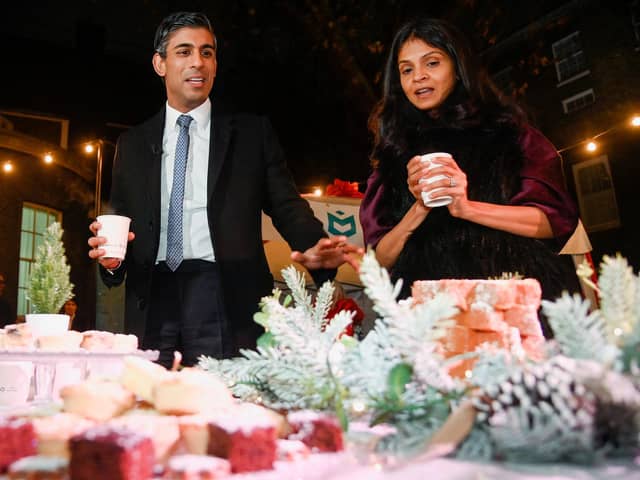 Prime Minister Rishi Sunak and wife Akshata Murty visits a food and drinks market as he hosts a festive showcase at Downing Street, London, in the form of a street market to champion businesses from across the UK ahead of Small Business Saturday.