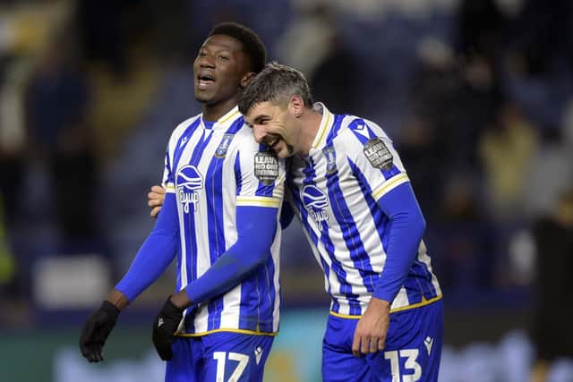 Happy with the point: Owls pair of DiShon Bernard and Callum Paterson (Picture: Steve Ellis)