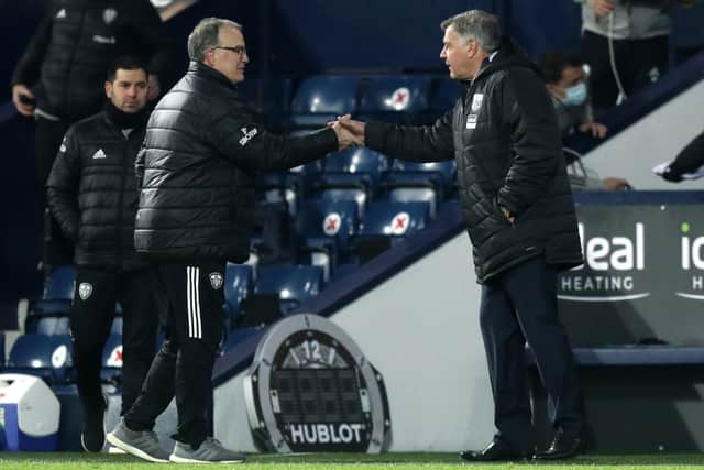 TAKE THAT: Sam Allardyce, then in charge of West Bromwich Albion, shakes hands with former Leeds United manager Marcelo Bielsa after the Whites rampaged to a 5-0 win at The Hawthorns in December 2020. Picture: Dave Rogers/PA