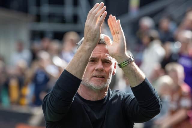 Bradford City manager Graham Alexander applauds supporters against Mansfield Town. Photo: Tony Johnson.