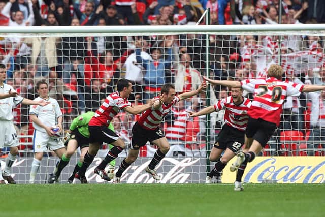 Doncaster Rovers' James Hayter (centre) celebrates scoring his sides first goal of the game with his team mates during the Coca-Cola League One Play Off Final at Wembley Stadium, London. PRESS ASSOCIATION Photo. Picture date: Sunday May 25, 2008. See PA Story SOCCER League One. Photo credit should read: Nick Potts/PA Wire. RESTRICTIONS: Use subject to restrictions. Editorial print use only except with prior written approval. New media use requires licence from Football DataCo Ltd. Call +44 (0)1158 447447 or see www.paphotos.com/info/ for full restrictions and further information. 