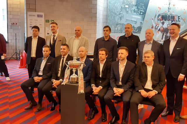 Ronnie O'Sullivan, back centre, and 13 of the world's best players at the media launch of this year's World Snooker Championships at the Crucible.