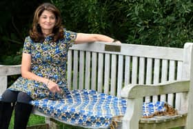 Daxa Patel sat on her father's memorial bench at Golden Acre park in Leeds.