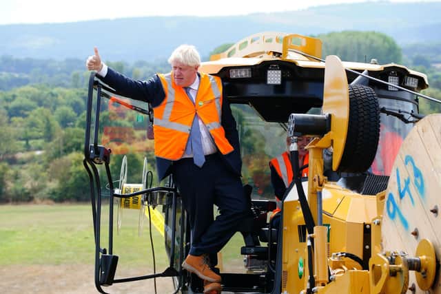 Prime Minister Boris Johnson during a visit to Henbury Farm in north Dorset, where Wessex Internet are laying fibre optics in the field on August 30, 2022 in Sturminster Marshall, England.(Photo by Ben Birchall/WPA Pool/Getty Images)