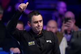 Another day at the office: An understated Ronnie O'Sullivan celebrates victory in the MrQ Masters Final against Ali Carter (Picture: Bradley Collyer/PA Wire)