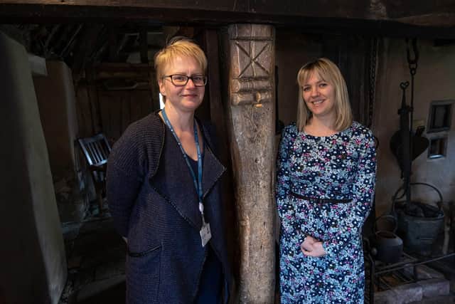 Outreach librarian at North Yorkshire Council, Fiona Diaper (left), and marketing and events co-ordinator at Ryedale Folk Museum, Rosie Barrett, next to a witch post at Ryedale Folk Museum.