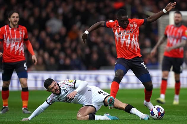 EDGED OUT: Middlesbrough's Alex Mowatt (left) challenges Luton Town's Marvelous Nakamba during last night's Championship clash at Kenilworth Road, the hosts winning 2-1 to remain third in the table.