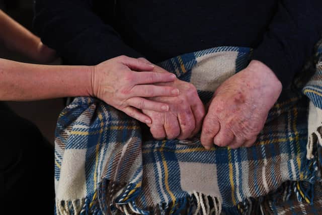 A care home resident with a carer in Yorkshire. PIC: Simon Hulme