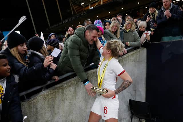 England's defender Millie Bright celebrates with members of her family after the Arnold Clark Cup women's international football match between England and Germany at the Molineux stadium in Wolverhampton (Picture: Adrian DENNIS / AFP via Getty Images)