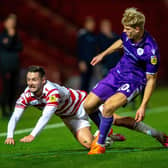 Luke Molyneux is pushed off the ball by Saxon Earley.
Doncaster Rovers v Stevenage FC.  SkyBet League 1.  Eco-Power Stadium.
25 October 2022.  Picture Bruce Rollinson