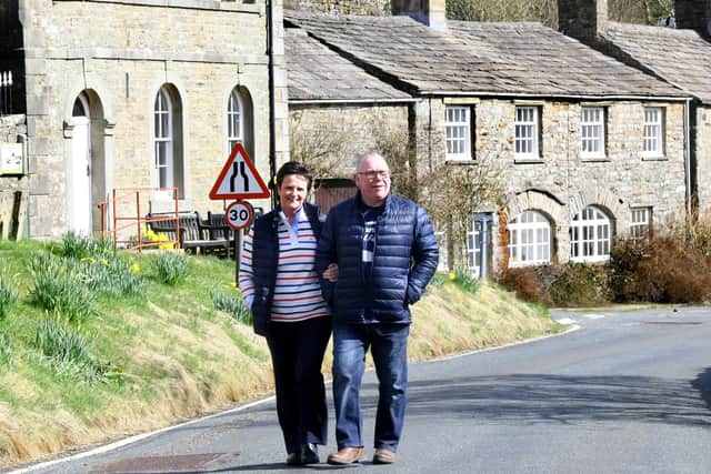 Andy Gascoigne and wife Mandy of The Farmers Arms  Muker , walking through the village.    Picture: Gary Longbottom