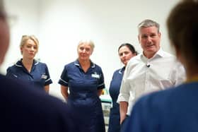 Labour leader Sir Keir Starmer talking to staff during a visit to the theatre recovery ward in the Bexley Wing of St James' University Hospital in Leeds. PIC: Joe Giddens/PA Wire