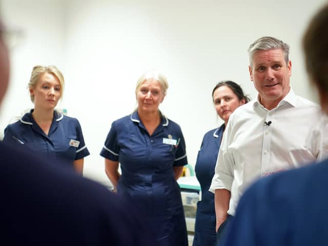Labour leader Sir Keir Starmer talking to staff during a visit to the theatre recovery ward in the Bexley Wing of St James' University Hospital in Leeds. PIC: Joe Giddens/PA Wire