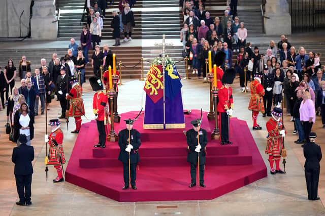 Scottish Secretary Alister Jack (front left) and Secretary of State for Defence Ben Wallace (front right) in ceremonial role as members of the Royal Company of Archers guard the coffin of Queen Elizabeth II, draped in the Royal Standard with the Imperial State Crown and the Sovereign's orb and sceptre, lying in state on the catafalque in Westminster Hall, at the Palace of Westminster, London, ahead of her funeral on Monday. Picture date: Thursday September 15, 2022.