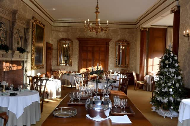 The magnificent dining room with historic fireplace