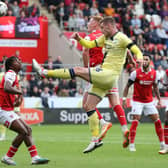 TUSSLE: Rotherham United's Sam Clucas competes for the ball with Preston North End's Liam Lindsay