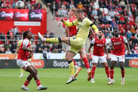 TUSSLE: Rotherham United's Sam Clucas competes for the ball with Preston North End's Liam Lindsay