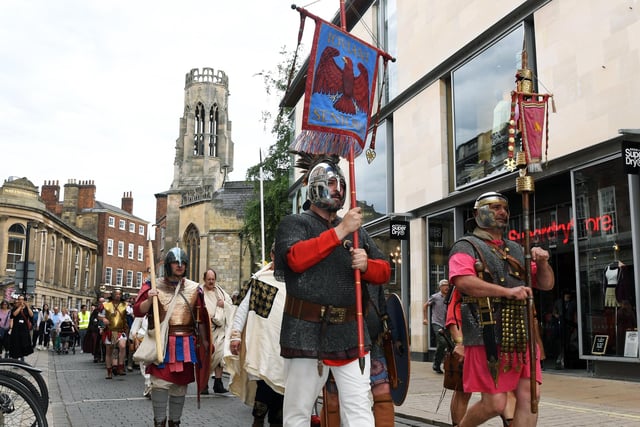 A parade of Romans walking through Museum Street during the festival.