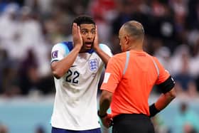 Jude Bellingham of England protests to Referee Wilton Sampaio during the video assistant referee review on a possible penalty incident during the FIFA World Cup Qatar 2022 quarter final match between England and France (Picture: Julian Finney/Getty Images)