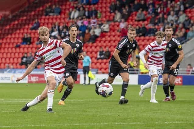 George Miller converts from the penalty spot for Doncaster Rovers against Crawley. Picture: Tony Johnson.