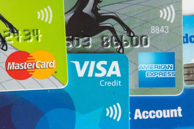 Credit cards showing the logos of American Express, Mastercard and Visa