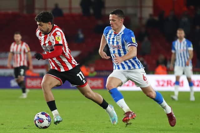 GAME-CHANGER: Jonathan Hogg, pictured closing down Sheffield United's Reda Khadra, turned the momentum Huddersfield Town's way