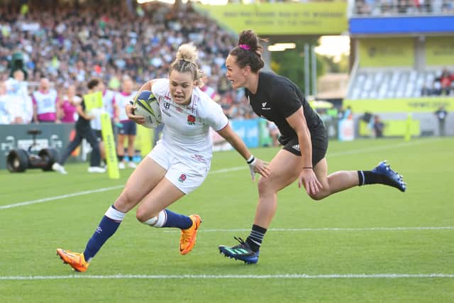 Ellie Kildunne of England scores a try against Portia Woodman of New Zealand during the Rugby World Cup 2021 Final. (Picture: Greg Bowker/Getty Images)