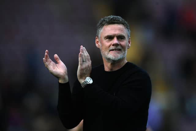 Bradford City manager Graham Alexander celebrates after his side's derby win against Huddersfield Town. Picture: Jonathan Gawthorpe