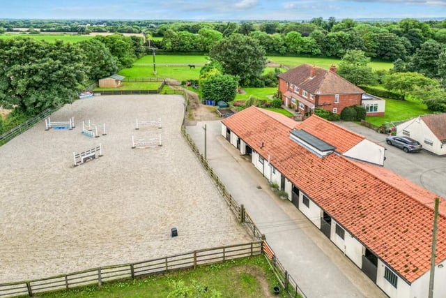A drone shot shows the extent of the property ad its rural surroundings