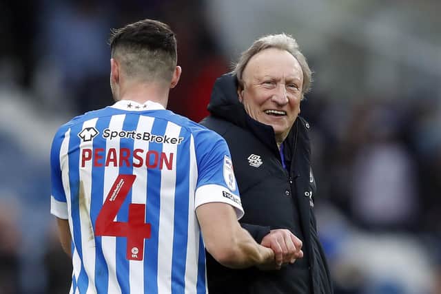 GAME ON: Huddersfield Town manager Neil Warnock and Matty Pearson celebrate after their 4-2 win against Middlesbrough at the John Smith's Stadium Picture: Will Matthews/PA
