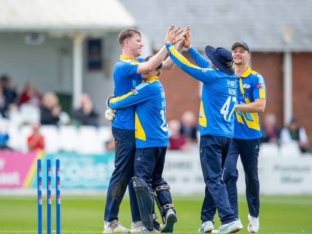 Matthew Revis, left, gets a big hug from wicketkeeper Harry Duke and a high-five from Dom Bess after taking a hat-trick against Kent at Scarborough. Picture by Allan McKenzie/SWpix.com