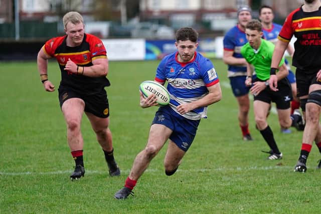 Breaking through: Sheffield Christian Hooper, centre, finds a way past the Hull defence in National Two North earlier this month.