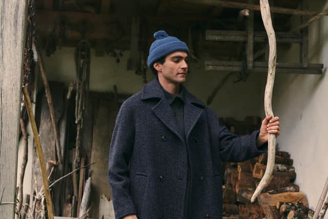 The AW collection was inspired by two muses – Saul Leiter and Jacques Tati – who used their art to encourage their audience to see the beauty and the humour in the everyday. Double Breasted Wool Overcoat, £595, Bobble Hat, £60.