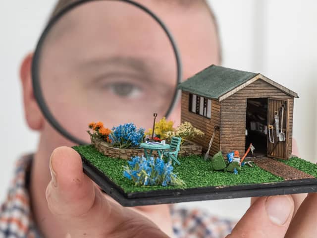 Graham Shapley takes a close look of 'Grandads Shed' by the creator known as Sheffield Miniatures. Photographed for The Yorkshire Post  by Tony Johnson.