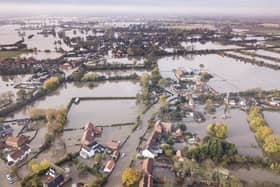 The village of Fishlake, Doncaster, submerged under flood water in 2019. Thousands of people had been evacuated as homes and businesses across northern England were destroyed. SWNS.