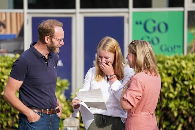 Millie Clark reacts when reading their A-level results at Norwich School, Norwich. (Pic credit: Joe Giddens / PA)