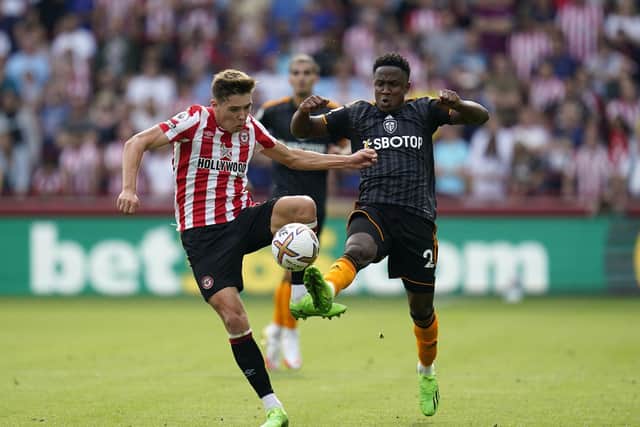 Brentford's Aaron Hickey (left) and Leeds United's Luis Sinisterra battle for the ball (Picture: Andrew Matthews/PA Wire)