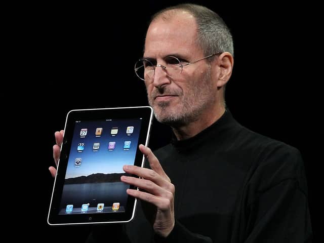 Steve Jobs holds up a new iPad as he speaks during an Apple Special Event at Yerba Buena Center for the Arts January 27, 2010 in San Francisco, California. (Photo by Justin Sullivan/Getty Images)