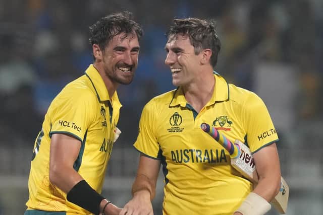 FINAL RECKONING: Mitchell Starc (left) and Australia's captain Pat Cummins celebrate their win over South Africa in the Thursday's semi-final in Kolkata. Picture: Photo/Bikas Das.