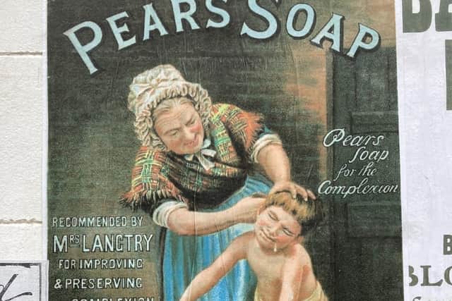 An advert for soap on display in a shop window in Blists Hill living museum