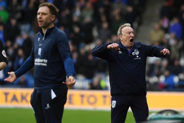 DELIGHTED: Neil Warnock celebrates Huddersfield Town's winner as Birmingham City coach John Eustace despairs