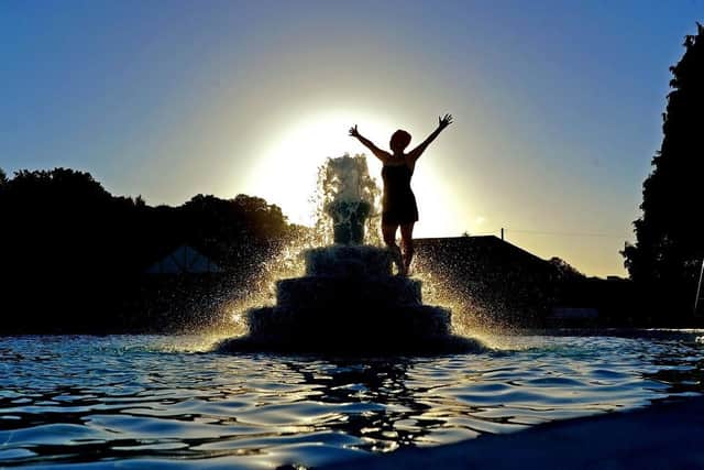 Swimmer Joanne Crowther at Ilkley Lido celebrates the summer solstice. (Pic credit: Tony Johnson)